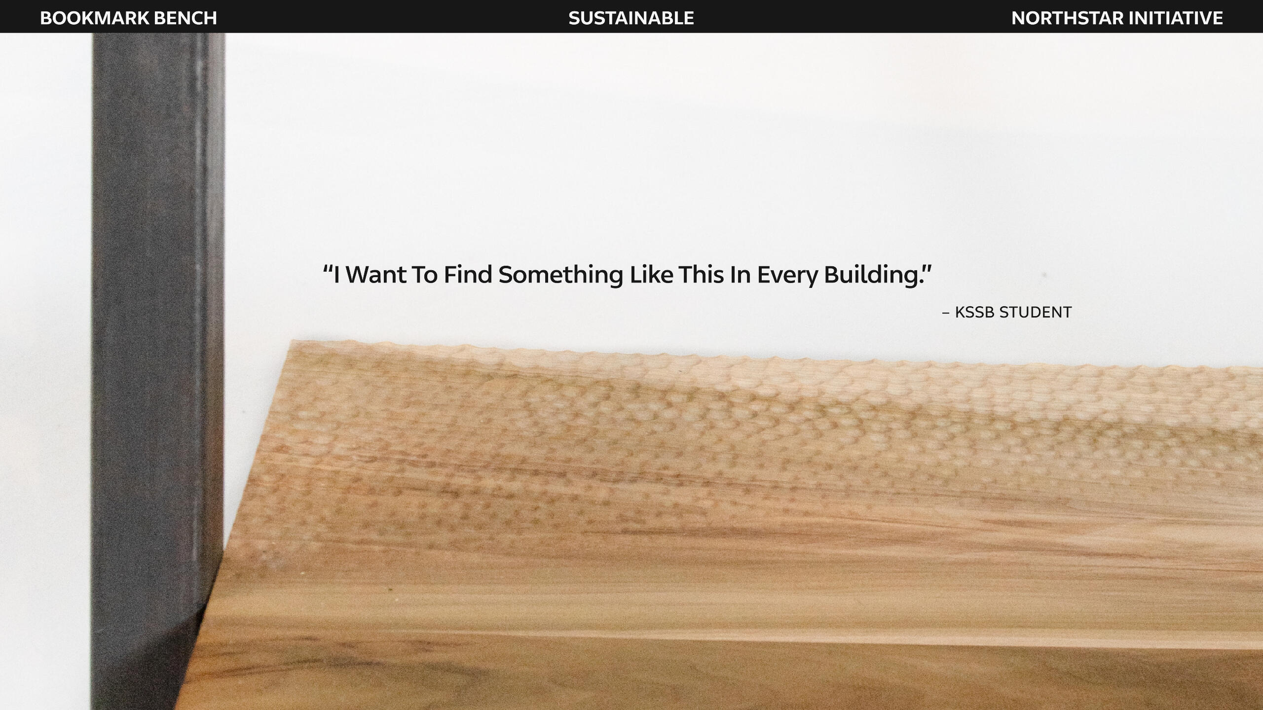 A zoomed in image of the Bookmark Bench, with the quote: "I want to find something like this in every building." from a Kansas State School of the Blind student.