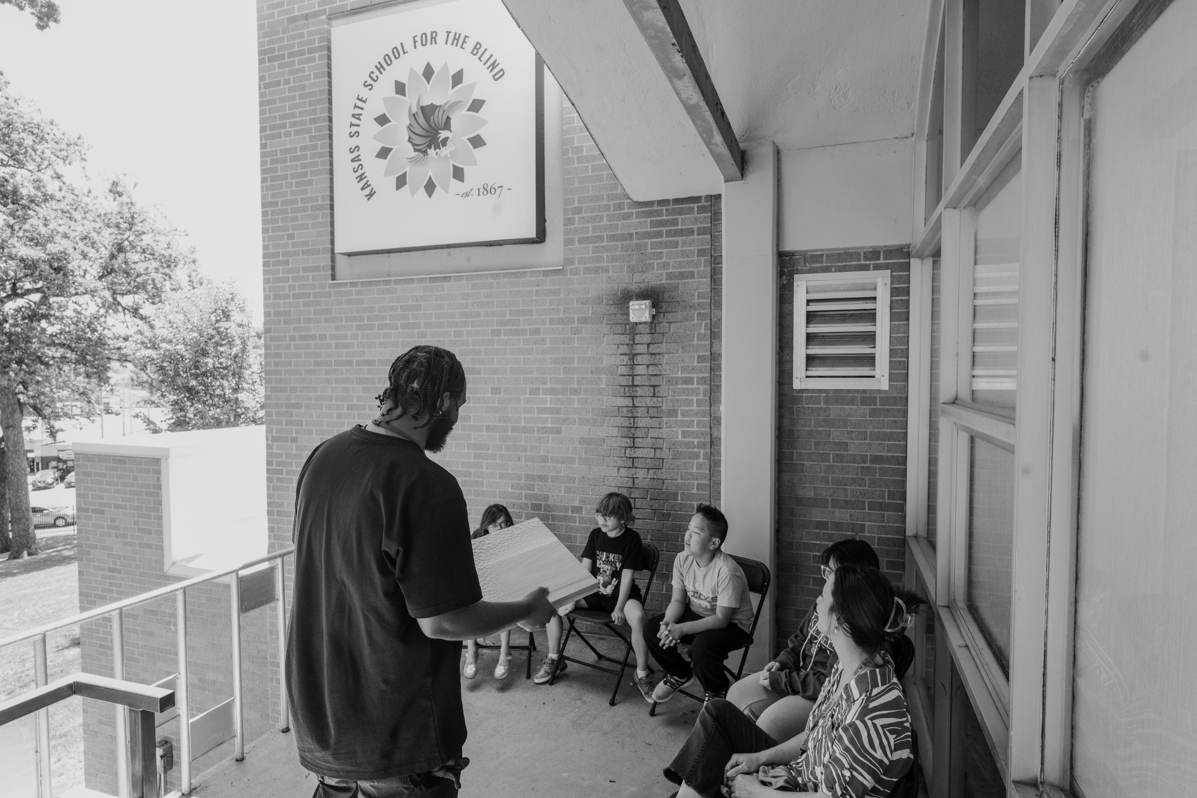 Northstar Bench Donation to Kansas State School for the Blind Founder Aaron McIntosh presenting archived directional texture prototypes to Kansas State School of the Blind Students.
